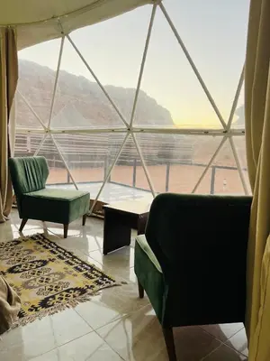 a living room with two chairs and a large window at Moon rum 2 in Disah