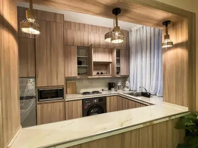 a kitchen with a washer and a dishwasher at Hawari Group in Umm Uthainah