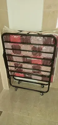 a metal cart filled with lots of ties at ستوديو مستقل داخل فيلا in Amman