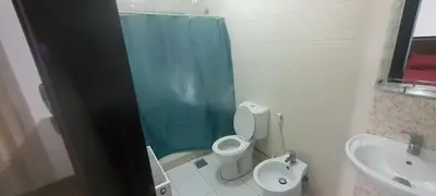 a bathroom with a toilet and a sink at Furniture apartment for families 3 bedroom in Al Bunayyāt ash Shamālīyah