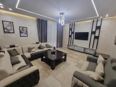 a large living room with couches and a table at Dier Ghbar 2 bedrooms-A in Amman