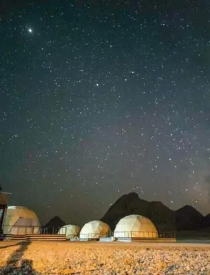 a group of domes under a starry sky at RUM MARS lUXURY CAMP in Wadi Rum