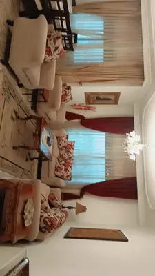 a room with a ceiling filled with lots of furniture at Said in Amman