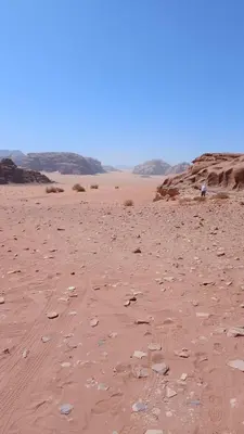 a desert with rocks and sand and a blue sky at Mountain star in Disah