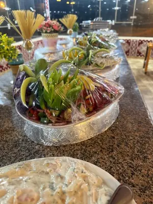 a buffet with several plates of food on a table at rum luxury camp in Wadi Rum