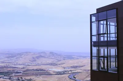 a building with a view of the mountains at Villa rose 3 in Khirbat Abū Ḩāmid