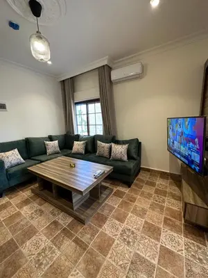 a living room with a couch and a coffee table at 10 Antica jabalal-lwebdeh in Amman