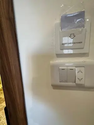 a lightswitch on a wall with a box on it at 11 Antica jabalal-lwebdeh in Amman