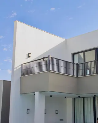 a white building with the letter t on it at Florya Villa by Seahorse in Amman