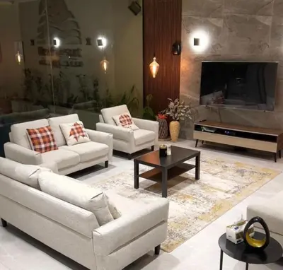a living room with two couches and a tv at sweetsoul in Amman