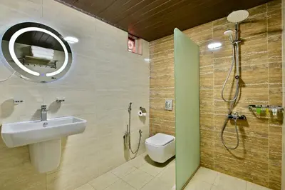 a bathroom with a sink and a toilet and a mirror at Mars Land Luxury Camp in Wadi Rum