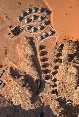 an aerial view of a building in the desert at Mars Land Luxury Camp in Wadi Rum