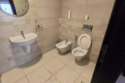 a bathroom with a toilet and a sink at Apartment the most upscale neighborhoods of Amman in Amman