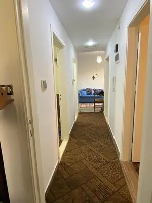 a hallway with a hallway leading to a living room at شقة مفروشة الدوار السابع خلف كوزمو in Amman