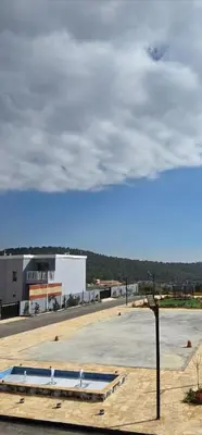 a view of a parking lot with a building at منتجع الحور in Ajloun