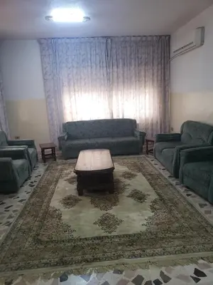 a living room with a couch and a coffee table at Alotaibi bulding in Amman