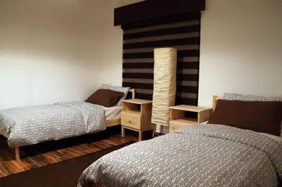 a bedroom with two beds and a lamp in it at Apartment in Amman with wow furniture in Amman