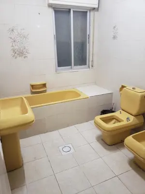 a bathroom with a tub and a toilet and a sink at ALOTAIBI bulding # 6 in Amman