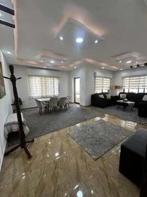 a living room with a couch and a table at 8-New and Spacious Apartments Close to Market in Amman