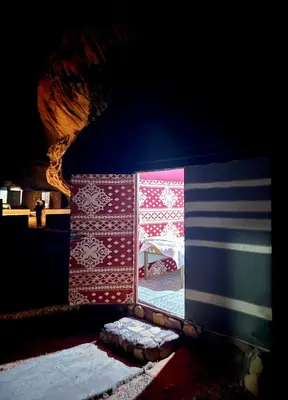a window with an american flag on it at Emad wadi rum camp in Wadi Rum
