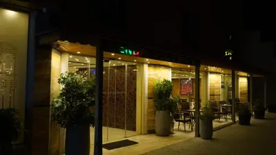 a store front of a restaurant at night at فندق ملتقى البتراء in Wadi Musa
