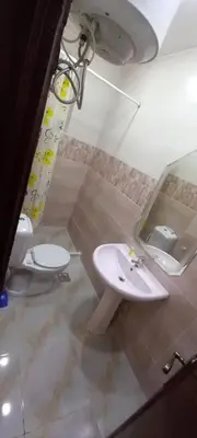 a bathroom with a sink and a toilet and a mirror at amman citadle in Amman