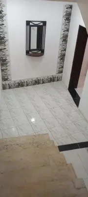 a room with a tile floor and a window on the wall at amman citadle in Amman