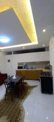 a kitchen with a table and chairs and a stove at amman citadle in Amman