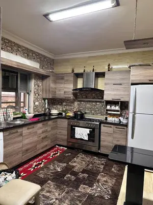 a kitchen with a stove top oven in a room at كريستال in Amman