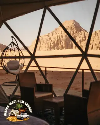 a view of the desert from a tent with a toy truck at Valera wadi rum Luxury in Wadi Rum