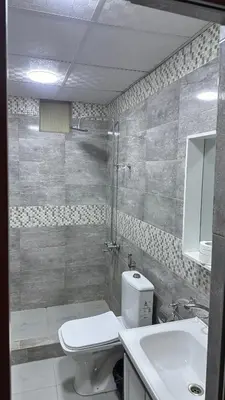 a bathroom with a toilet and a sink at Welcome to Wadi Rum in Wadi Rum