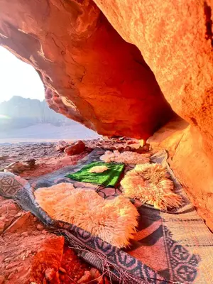 a view of a rock cave with a painting on it at wadi Rum Spirit of Peace Camp in Wadi Rum