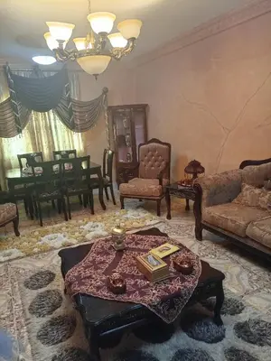 a living room with a couch and a table at Hello hostel in Amman