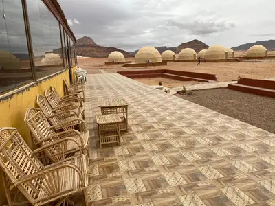 a group of chairs sitting on the side of a bus at wadi Rum Mohammed in Wadi Rum
