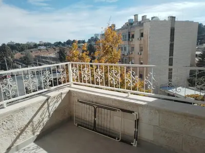 a balcony with a view of a building at Amman Sweet-Home - 2 bedrooms Apartment in Amman