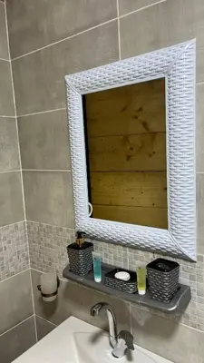 a bathroom with a mirror above a sink at Monica Wadi Rum in Wadi Rum