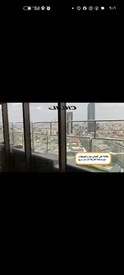 a window in a building with a view of a city at شقه دوبلكس داماك العبدلي in Amman