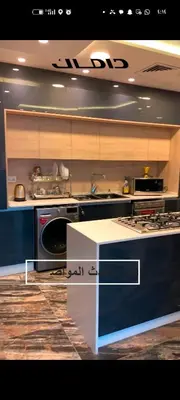 a kitchen with a stove and a dishwasher at شقه دوبلكس داماك العبدلي in Amman