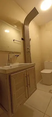 a bathroom with a sink and a toilet at Uncle Ali hotel in Wadi Musa