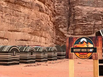 a sign for the desert rock camp in a canyon at Desert Rock Wadi Rum in Wadi Rum