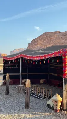 a large building with a tent in the desert at Princess Camp in Wadi Rum