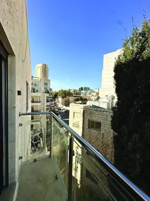 a balcony of a building with a view of a city at Alsadi Housing- Jabal Amman in Amman