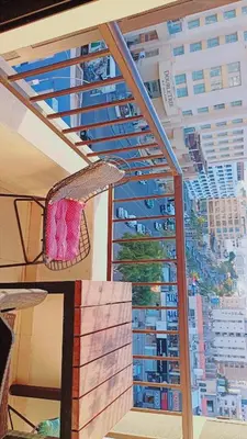 a window with a view of a city at فندق الشلالات العقبه Waterfalls Hotel Aqaba in Aqaba