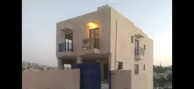 a building with a light on top of it at citadel mountain sun guest house in Amman