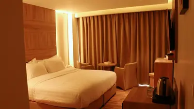 a hotel room with a bed and a window at Aysel Hotel in Aqaba