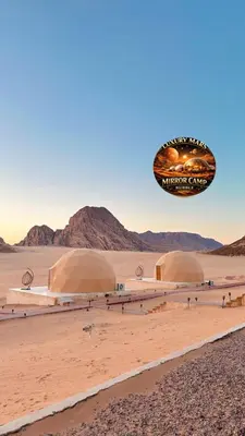 a group of domes in the desert at MARS MIRROR BUBBLE lUXURY CAMP in Wadi Rum