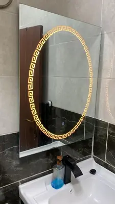 a mirror over a sink in a bathroom at Osama Alnaser in Amman