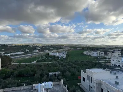 an aerial view of a city with buildings at شقه مفروشه حديثة ذات أطلالة جميلة ومكان هادئ in Irbid