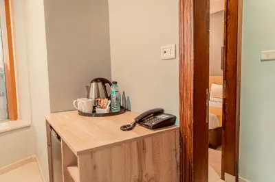 a telephone sitting on top of a desk in a room at Baden Hotel Suites in Amman