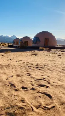 a group of domes in the middle of a desert at Olivia Rum Luxury Bubbles & Jeep Tours in Wadi Rum